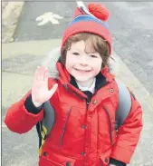  ??  ?? A JOYOUS WAVE - Junior Infant, Ultan Flynn waves goodbye upon his return to school in Bunscoil na Toirbhirte this week, as some pupils finally returned to their classrooms.