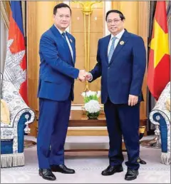  ?? STPM ?? Prime Minister Hun Manet shakes hands with his Vietnamese counterpar­t Pham Minh Chinh (right) on the sidelines of the ASEAN-Gulf Cooperatio­n Council (GCC) Summit in Saudi Arabia in October.