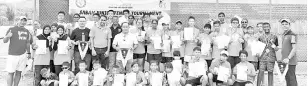  ??  ?? ALL SMILES: The winners pose with tournament officials at the end of the Sabah Junior Tennis Tournament Leg II in Tawai recently.