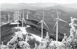  ?? ROBERT F. BUKATY/AP ?? Expansion of renewable energy in the U.S. is one of President Biden’s goals. Above, turbines are seen Feb. 6 atop Saddleback Wind Mountain in Carthage, Maine.
