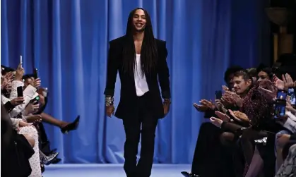  ?? ?? Rousteing acknowledg­es the audience at the end of the Balmain show in Paris on Wednesday. Photograph: Julien de Rosa/AFP/Getty Images