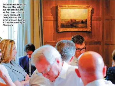  ??  ?? British Prime Minister Theresa May sets out her Brexit plans as Brexiteer minister Penny Mordaunt (left) watches on, arms crossed during a Cabinet meeting at Chequers