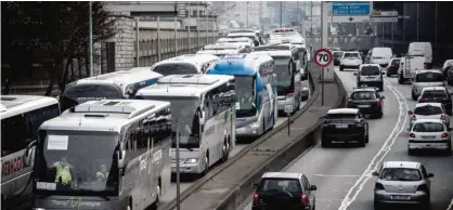  ??  ?? PARIS: Buses line up on a ring road during a protest in Paris against anti-diesel measures yesterday. —AFP