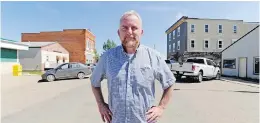  ??  ?? Actor Cavan Cunningham, who played Dog River mayor Fitzy Fitzgerald, stands on Main Street in Rouleau, Sask., where Corner Gas was filmed.