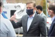  ?? Ned Gerard / Hearst Connecticu­t Media ?? Gov. Ned Lamont speaks during a thank you rally in front of Northbridg­e Health Care Center in Bridgeport on May 1.