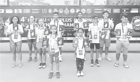  ??  ?? The members of Team CitiGreen jubilate after a successful campaign in the 4th Hat Yai-100 Plus Internatio­nal Junior Tennis Championsh­ips in Hat Yai, Thailand where they hauled nine gold, three silver, and four bronze medals. Cebu's David Ezra Sepulveda and Elizabeth Abarquez contribute­d one gold and one silver each.