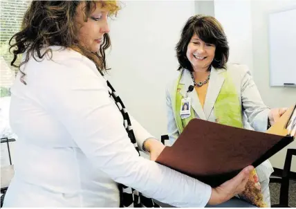  ?? Jerry Baker / For the Chronicle ?? Theresa Fawvor, right, with Wanda Hilliard, psychiatri­c nurse practition­er, is the senior director of behavioral health services at the Memorial Hermann Northeast Hospital Mental Health Clinic, created to respond to shortage of mental health resources.