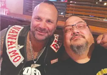  ??  ?? Garden store owner Zale Coty, right, is shown with Hells Angel Chad Wilson, who was gunned down in November.