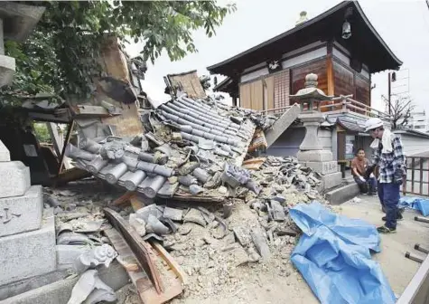 ?? Reuters ?? The Myotoku-ji temple in Ibaraki, Osaka prefecture, western Japan, was damaged by the earthquake yesterday. Japan sits on the Pacific ‘Ring of Fire’ where many of the world’s earthquake­s and volcanic eruptions are recorded.