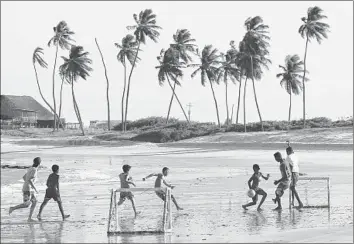  ?? Gernot Hensel European Pressphoto Agency ?? CHILDREN PLAY on a beach just north of Natal, Brazil. With a World Cup match set in Natal, the issue of travelers coming to town to find cheap — and often underage — sexual partners is in the public attention.