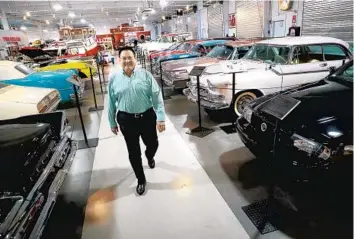  ?? CARLINE JEAN/SOUTH FLORIDA SUN SENTINEL PHOTOS ?? Dr. Edward Dauer walks through the Dauer Museum of Classic Cars.