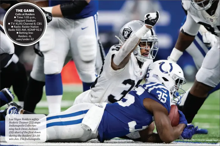  ?? ZACH BOLINGER / ASSOCIATED PRESS FILE ?? Las Vegas Raiders safety Roderic Teamer (33) stops Indianapol­is Colts running back Deon Jackson (35) short of the first down during the Raiders’ 23-20 win Jan. 2 in Indianapol­is.