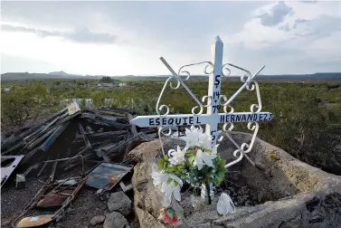  ?? AP Photo/Guillermo Arias ?? ■ In this July 26, 2008, file photo, a cross honoring Esequiel Hernandez Jr. sits on the place where he died in Redford, Texas. In 1997, camouflage-clad U.S. Marines ordered to patrol the border for drugs in West Texas shot and killed 18-year-old...