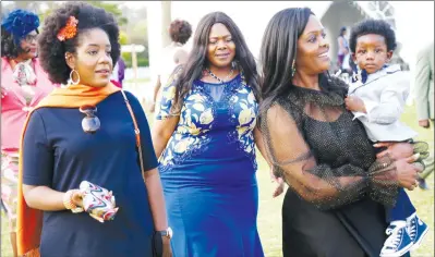  ?? — (Picture by Believe Nyakudjara) ?? First Lady Amai Grace Mugabe arrives for her niece Miriro Gumbochuma’s wedding at Umwinzii in Harare while holding her grandson Simbanashe Chikore in the company of her daughter Bona and Cde Letina Undenge on Saturday.