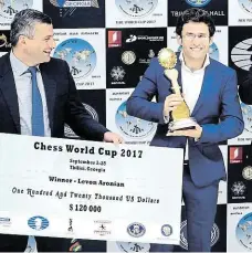  ?? (vpravo) vyhrál podruhé Světový pohár v šachách FOTO FIDE ?? Levon Aronjan
