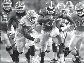  ?? AP/JOHN BAZEMORE ?? Georgia running back Nick Chubb breaks away from North Carolina linebacker Andre Smith in the first quarter of Saturday’s game. Chubb, in his first game back since suffering a season-ending injury in October, ran for 222 yards and two touchdowns to...