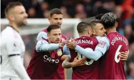  ?? Photograph: Carl Recine/Reuters ?? Aston Villa players congratula­te Lucas Digne (second right) on their side’s second goal.