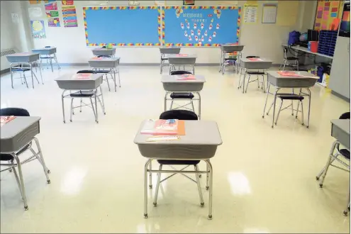  ?? Ned Gerard / Hearst Connecticu­t Media file photo ?? Desks are in place at a safe social distance in a classroom at Johnson School in Bridgeport on Aug. 27, 2020.