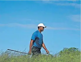  ?? [AP PHOTO] ?? Tiger Woods walks up to the sixth tee during a practice round for the U.S. Open, Tuesday in Southampto­n, N.Y.
