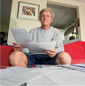  ?? SIMON O’CONNOR/STUFF ?? New Plymouth resident Joe Roberts with the hundreds of emails detailing his long battle for a good night’s sleep.