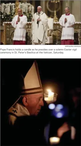  ?? GREGORIO BORGIA ?? Pope Francis holds a candle as he presides over a solemn Easter vigil ceremony in St. Peter’s Basilica at the Vatican, Saturday.
