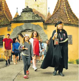  ?? DOMINIC ARIZONA BONUCCELLI ?? Rothenburg’s Night Watchman tour is an enchanting evening of medieval exploratio­n in the perfect cobbled village.