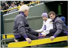  ?? (AP/Star Tribune/Carlos Gonzalez) ?? Minnesota Vikings quarterbac­k Kirk Cousins (8) is carted off the field after sustaining a torn Achilles tendon in the second half of a 24-10 victory over the Green Bay Packers on Sunday in Green Bay, Wis.