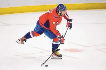  ?? NICK WASS/ASSOCIATED PRESS ?? Washington Capitals standout Alex Ovechkin, in his 17th season, takes aim at the goal during Thursday’s game against Chicago.