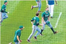  ?? CYNDI CHAMBERS/GAINESVILL­E SUN
CORRESPOND­ENT ?? The Hurricanes won the rubber match 8-6 against the Gators at Florida Ballpark in Gainesvill­e on Sunday.