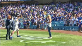  ?? Courtesy photo ?? Actress Kelly Packard sings the national anthem before the start of Game 5 of the National League Championsh­ip Series. Packard is from Santa Clarita.