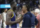  ?? TONY AVELAR — THE ASSOCIATED PRESS ?? Golden State Warriors forward Draymond Green, left, talks with the Memphis Grizzlies' Ja Morant after Game 6of a Western Conference playoff semifinal in San Francisco on Friday. The Warriors won 110-96 and advanced to the conference finals.
