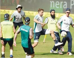  ?? — AFP ?? MUMBAI: England cricketers play football during the training session at the Wankhede stadium ahead of the fourth Test cricket match between India and England in Mumbai yesterday.