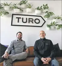  ?? Eric Risberg Associated Press ?? STEVE WEBB, vice president of communicat­ions, left, and CEO Andre Haddad in the entryway of Turo in San Francisco.
