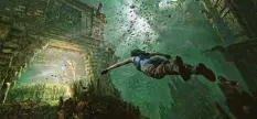  ?? Foto: Square Enix, dpa ?? In „Shadow of the Tomb Raider“ist die Archäologi­n Lara Croft mal wieder dauernd in Schwierigk­eiten – hier sogar unter Wasser.