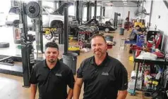  ?? Dave Rossman / Contributo­r ?? Glenn Piccolo and Kevin Bratton are area directors at Louetta Automotive at 16616 House Hahl Road in Cypress. The company has 10 locations.