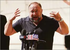  ?? Joe Buglewicz / TNS ?? Infowars founder Alex Jones speaks to the media outside Waterbury Superior Court during his trial on Sept. 21 in Waterbury.