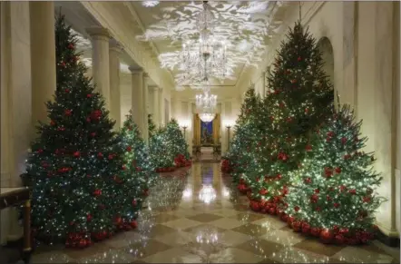  ?? CAROLYN KASTER — THE ASSOCIATED PRESS ?? The Cross Hall is seen during the 2018 Christmas Press Preview at the White House in Washington, Monday. Christmas has arrived at the White House.