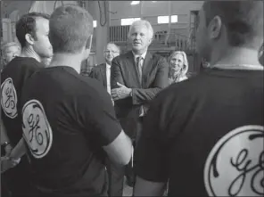  ?? AP/THIBAULT CAMUS ?? General Electric Co. Chief Executive Officer Jeffrey Immelt (center) speaks with workers at the GE plant in Belfort, France, during a 2014 visit.