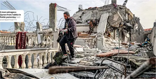  ?? SAID KHATIB/AFP/GETTY ?? A man salvages a Quran from rubble in Rafah yesterday