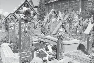  ??  ?? The irreverent Merry Cemetery in the north of Romania is a celebratio­n of life.