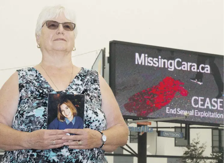  ?? DAVID BLOOM ?? Kathy King, pictured holding a photo of her daughter Cara, hopes a billboard in Edmonton will raise awareness about the case as well as spark tips on other unsolved cases of missing and murdered women.