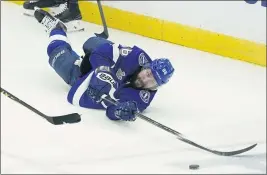  ?? GERRY BROOME — THE ASSOCIATED PRESS ?? Tampa Bay right wing Nikita Kucherov reaches for the loose puck during the second period in Game 2of the Stanley Cup final against Montreal on Wednesday.