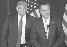  ?? MICHAEL NELSON, EPA ?? Donald Trump endorses GOP presidenti­al candidate Mitt Romney at Trump Internatio­nal Tower Hotel in Las Vegas in 2012.