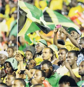  ??  ?? Fans of the Reggae Boyz inside the National Stadium in Kingston during a football match.