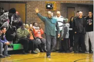  ?? Michael Cummo / Hearst Connecticu­t Media ?? Former Trinity Catholic basketball star Earl Johnson waves to the crowd before having his jersey retired by Trinity Catholic.