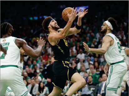  ?? NHAT V. MEYER — BAY AREA NEWS GROUP ?? The Warriors' Klay Thompson, left, loses control of the ball as he drives against the Celtics' Derrick White in Game 3at TD Garden in Boston.