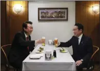  ?? (AP/Japan’s Cabinet Public Affairs Office) ?? South Korean President Yoon Suk Yeol (left) and Japanese Prime Minister Fumio Kishida make a toast Thursday at Rengatei restaurant in the famed Ginza district of Tokyo.