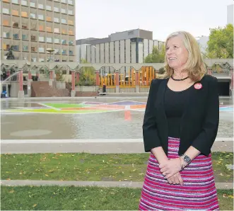  ?? JIM WELLS ?? Calgary 2026 CEO Mary Moran pauses at Olympic Plaza, a legacy from the 1988 Calgary Winter Olympics. The organizati­on began its public engagement campaign with a town hall event on Thursday.