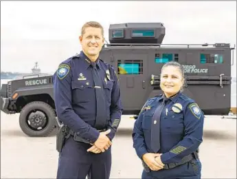  ?? PORT OF SAN DIEGO ?? Magda Fernandez (right) became first Latina woman to become police chief in the county when she was sworn in as the head of the Harbor Police Department. Jeffrey Geary was also named assistant chief.