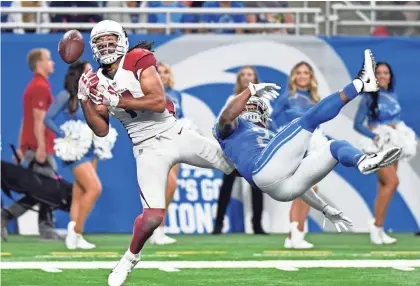  ?? JOSE JUAREZ/AP ?? Cardinals receiver Larry Fitzgerald can't catch a pass as Lions cornerback Quandre Diggs defends in the fourth quarter on Sunday in Detroit.